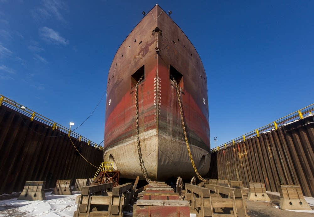 Red steel ship being constructed with ABS grade plates