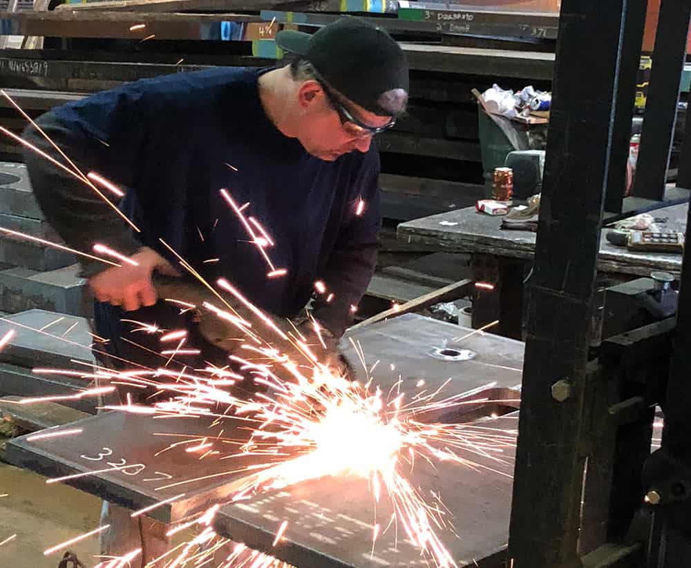 Delaware Valley Steel team member cutting steel