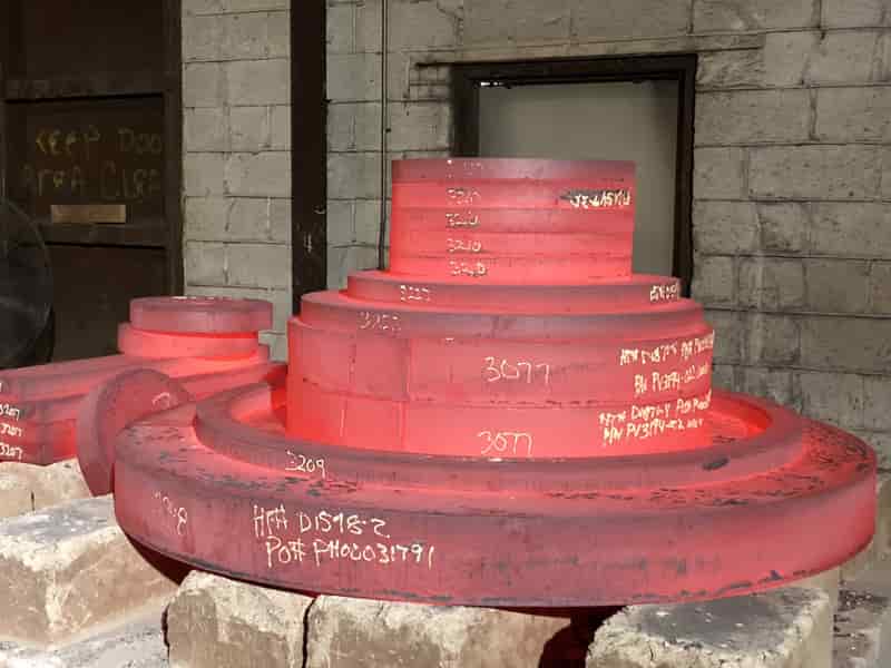 Stack of red hot alloy plates at Pennsylvania steel plate supplier